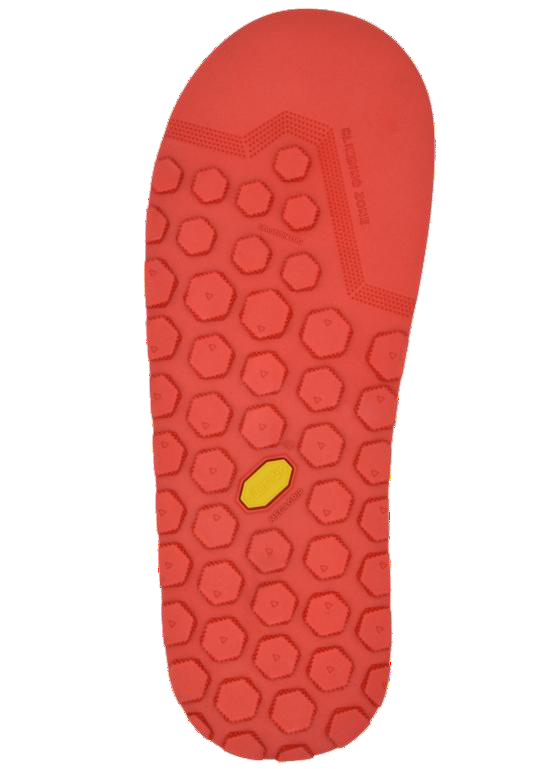 Red shoe sole with a textured pattern on a white background