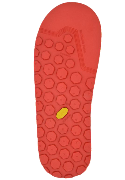 Red shoe sole with a textured pattern on a white background